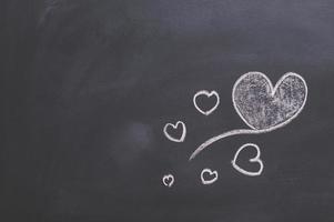 Heart doodles on the blackboard photo