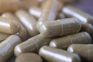 Close up herbal medicine capsules photo