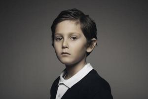 Studio portrait of a handsome kid portrait looking at the camera photo