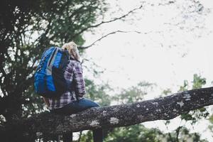 Rear of young hiker enjoying nature photo