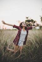 Portrait of young beautiful woman at sunset photo