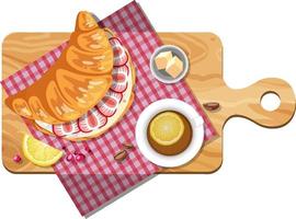 Top view of croissant sandwiches and tea cup on a cutting board vector