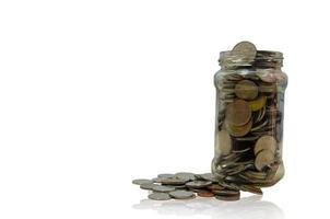 Silver coins put together in a glass jar photo