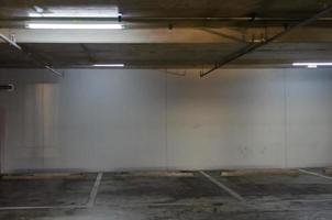 An empty car park is inside a building photo