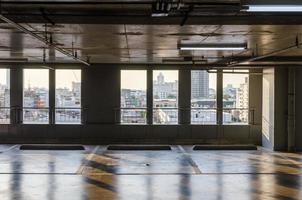 An empty car park is inside a building photo