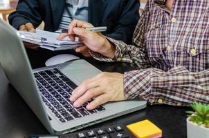 A business meeting to review documents and information on marketing and financial statements, reports, and business planning photo