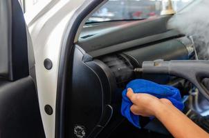 Steam cleaning in the car's air vents photo