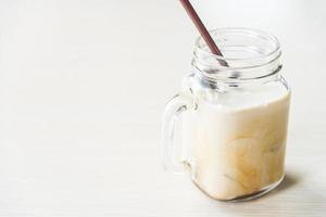 Iced coffee glass on the table photo