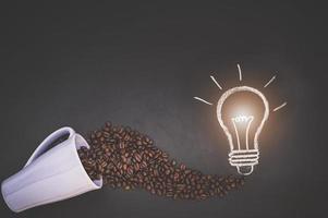 Coffee beans in a cup and doodle on the blackboard photo