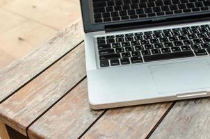 Laptop on table photo