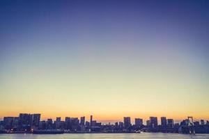 Cityscape of Tokyo city with the Rainbow bridge photo