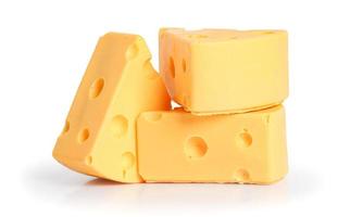 Three wedges of yellow cheese with holes on white background photo