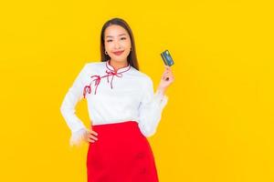 Young asian woman with credit card photo