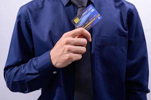 Businessman holding a credit card photo