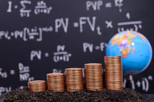 Coins in front of a blackboard photo
