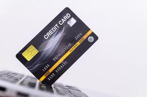 Credit card on laptop keyboard photo