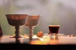 Coffee and flowers on a table photo