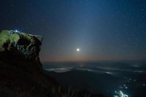 Cliff and starry sky photo