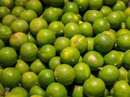 Fresh green lemons photo