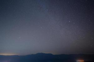 Starry sky and mountains photo