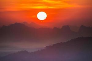 Colorful sunrise over mountains photo