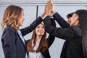 Coworkers high fiving photo