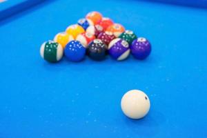 Billiard balls on blue table photo