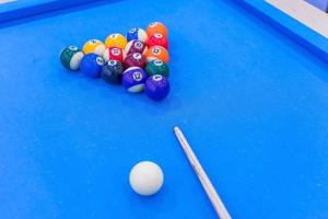 Billiard balls on blue table photo