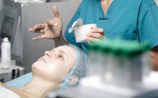 Woman receiving a skincare treatment photo