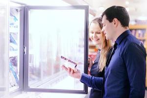 Couple in the frozen goods section photo