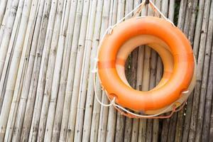 Rings hanging on a wooden wall photo