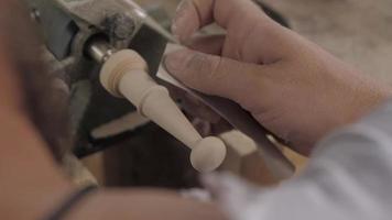 Worker Grinds Wood with Sandpaper video