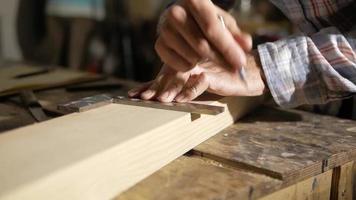 Carpenter Measuring with A Square video