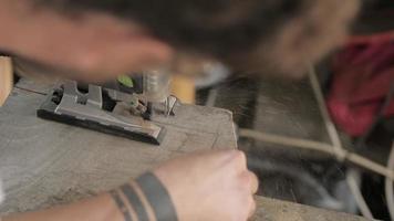 Man Sawing a Board with A Jigsaw video