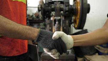 Handshaking Between Two Factory Workers video