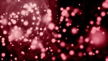 Bokeh de particules rouges douces flottant sur fond noir video