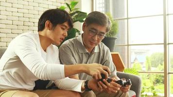 Father And Son Happily Play A Game Together video