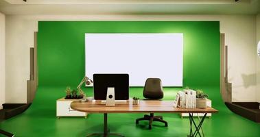 studio avec un bureau et un fond vert video