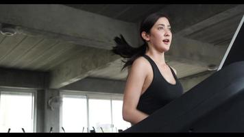 Athletic Woman Running on A Treadmill video