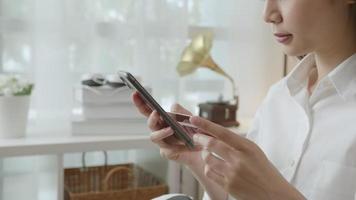 Woman Holding a Smartphone and A Credit Card video