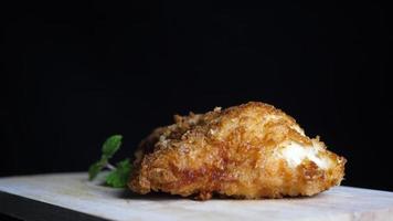 Fried Chicken on A Wood Cutting Board with Mint Leaves video