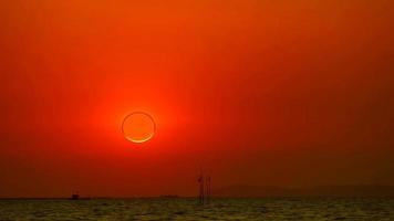 Eclipse and diamond ring phenomenon as the sun sets