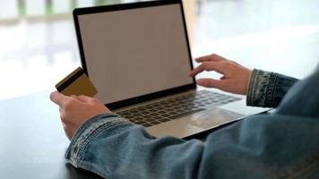 Woman Holding Credit Card and Using a Computer for Shopping Online video