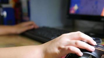 Kid Playing Game Computer With Mouse And Keyboard Closeup video