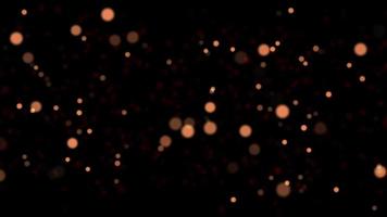 Seamless loop soft focus light golden particles Amber over dark background video