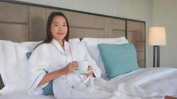 Woman holding mug smiling at camera video