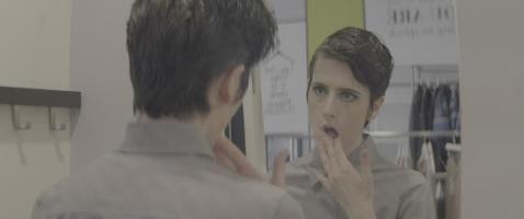 Young Woman Looks at Herself in the Mirror video