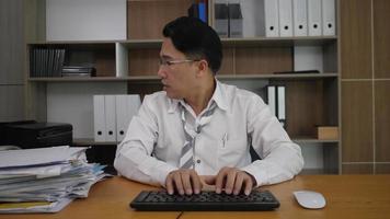 Businessman office worker typing on a laptop computer
