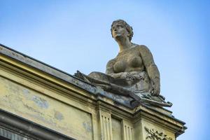 Sculptures on the roof of Arena del Sole Theatre in Bologna photo