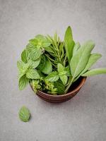 Bowl of fresh herbs photo